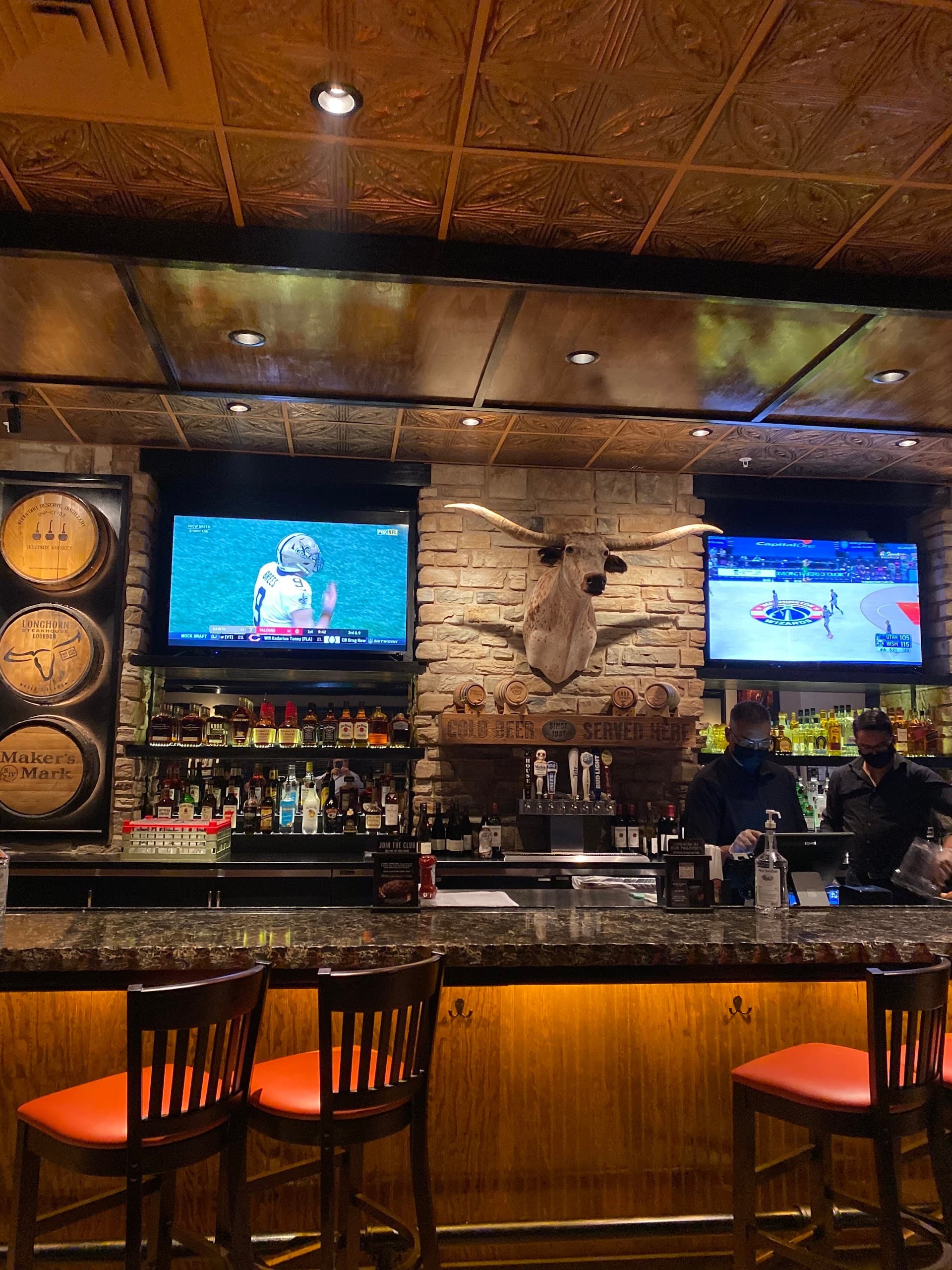 Bar scene at The Falls in Miami with TVs