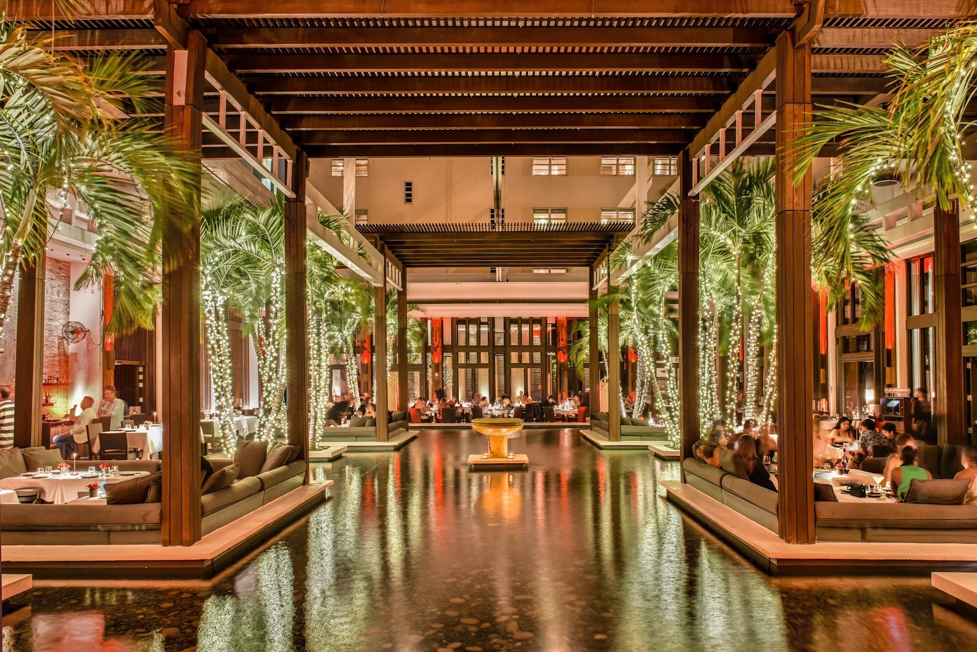 The Setai dining area with palm trees in Miami Beach