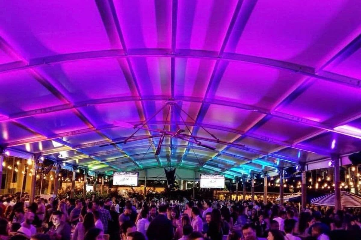 Vibrant nightlife at The Wharf Miami, colorful lights