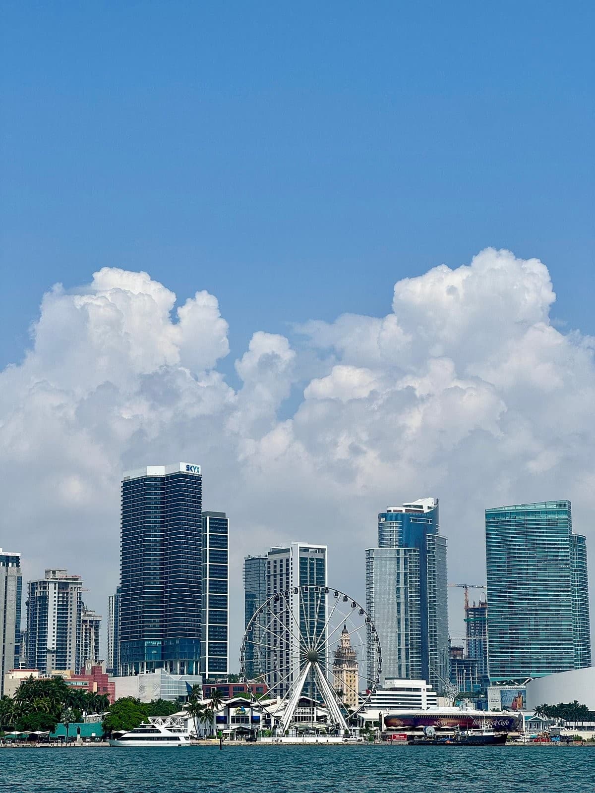 Miami skyline with Ferris wheel and clouds