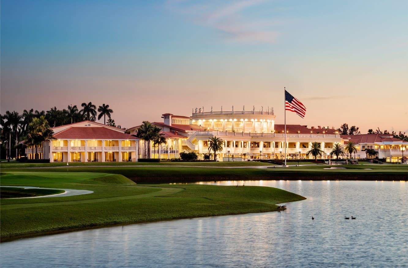 Trump National Doral Miami at dusk with palm trees