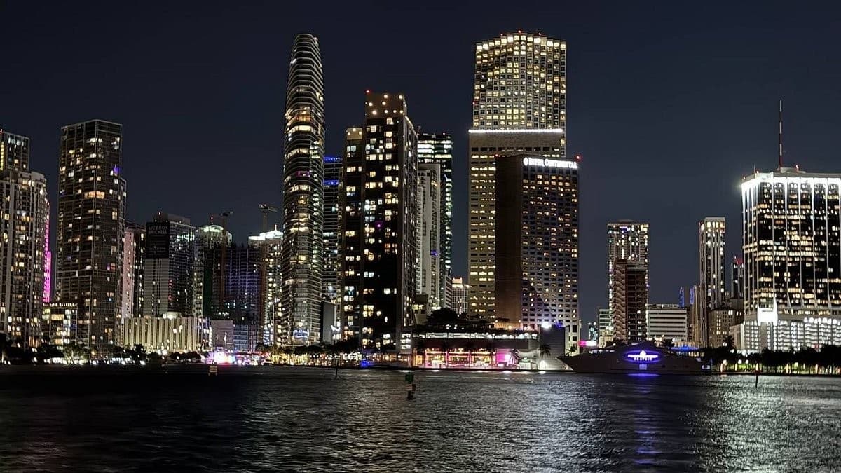 Miami skyline at night featuring UNIQ Miami Yacht Charters