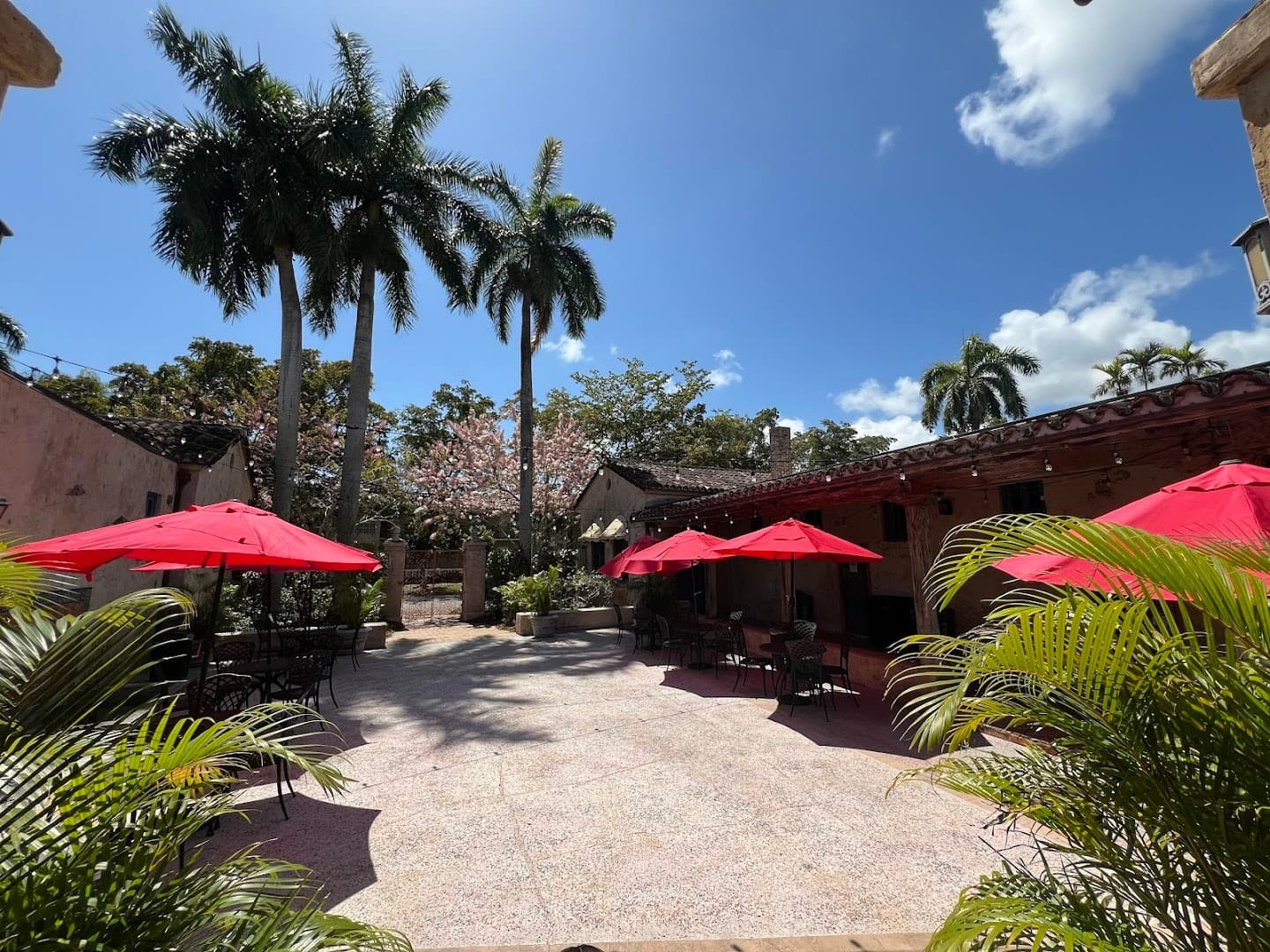 Venetian Pool outdoor area with red umbrellas in Coral Gables