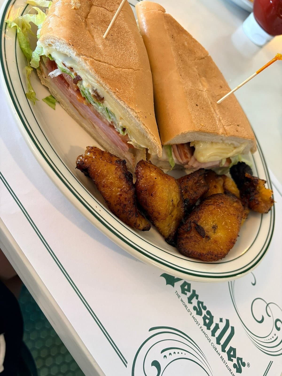 Cuban sandwich and fried plantains at Versailles Restaurant, Miami