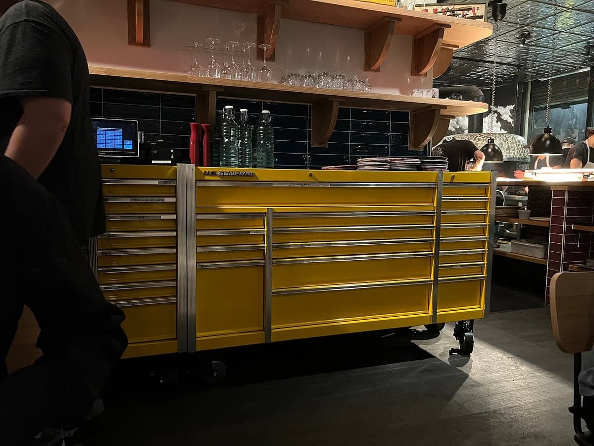 Walrus Rodeo interior view with vibrant yellow tool chest in Miami