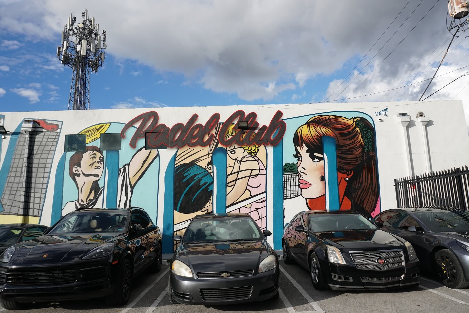 Wynwood Padel Club mural and cars in Miami