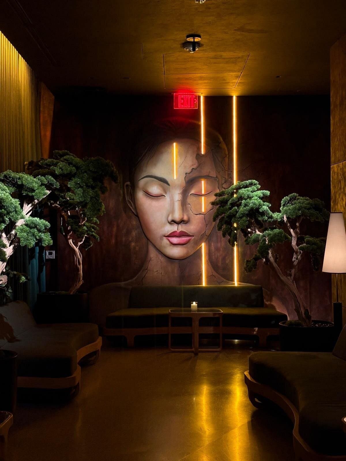 Yamashiro Miami interior with artistic mural and greenery