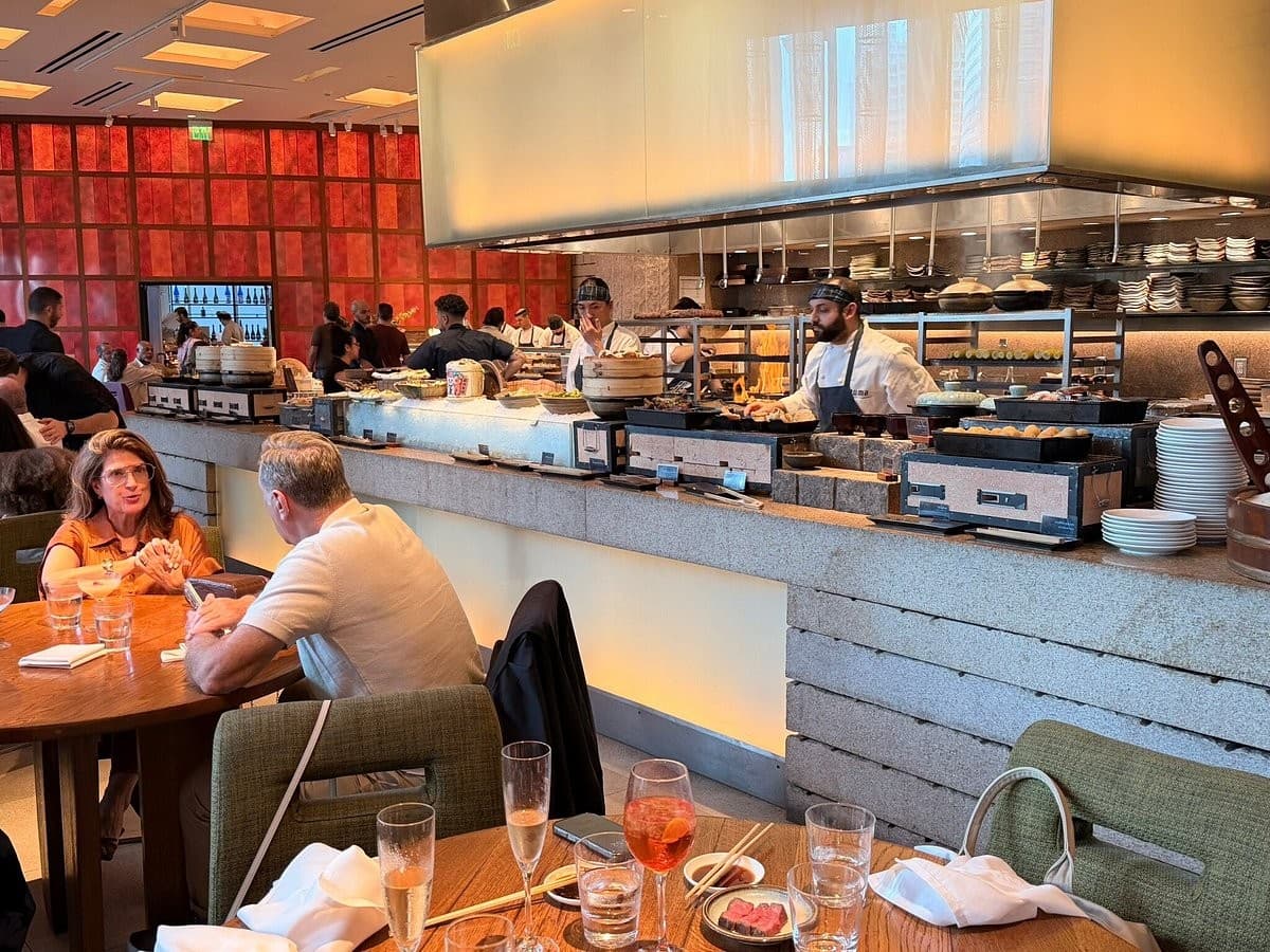 Dining scene at Zuma Miami with guests and food